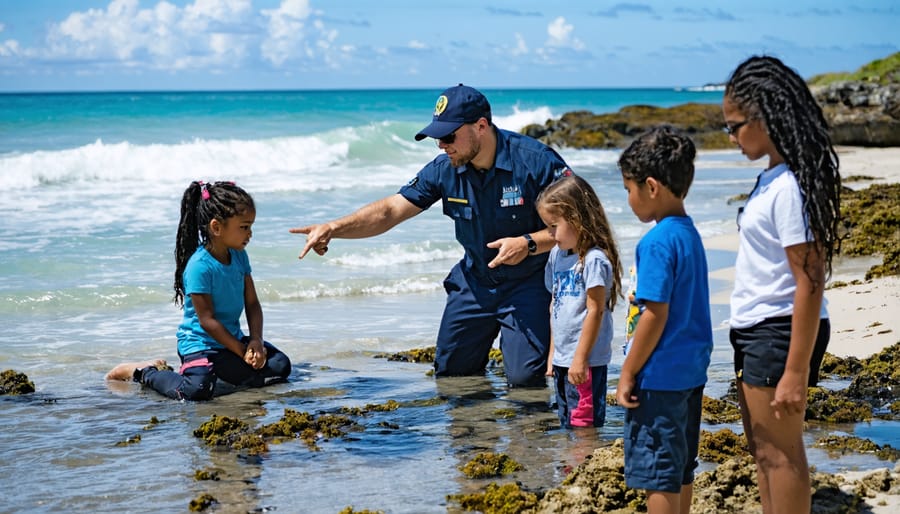 Marine educator engaging with students during hands-on beach exploration lesson