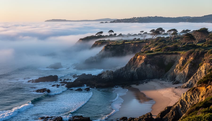 Marine layer fog rolling over coastal cliffs and ocean waters